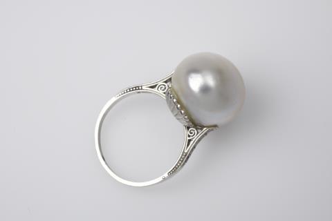 
    Ca. 1910.A Belle Epoque platinum ring with a rare natural pearl, Auction 1096, Lot 575
