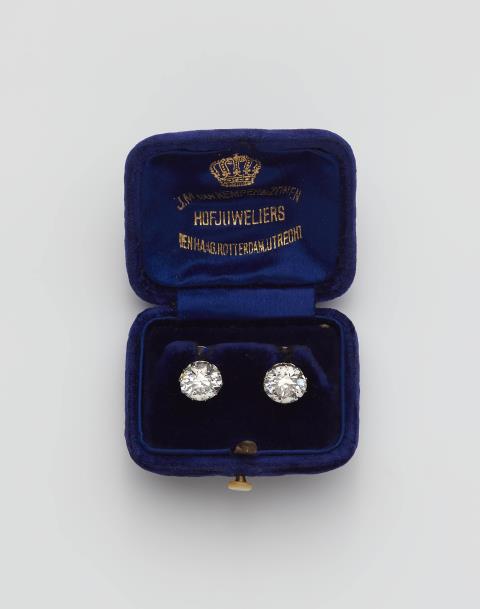 
    
            
                    A pair of 14k gold and transition-cut diamond solitaire stud earrings.
                
        
