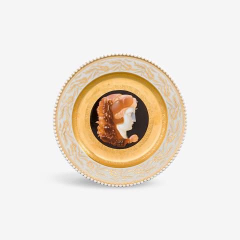 
    
            
                    A KPM Berlin porcelain dessert plate with cameo painting from the wedding service for Princess Louise of Prussia
                
        

