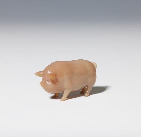 
    
            
                    A naturalistical carved chalcedony model of a standing pig with ruby set eyes.
                
        
