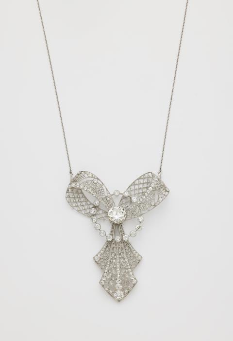 
    
            
                    An important platinum and diamond Belle Epoque bow pendant necklace. Alternatively, can also be worn as a brooch with a screw-on pin.
                
        
