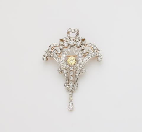 
    
            
                    A 14k gold platinum and diamond Belle Epoque pendant brooch with a replaced natural fancy intense yellow diamond.
                
        
